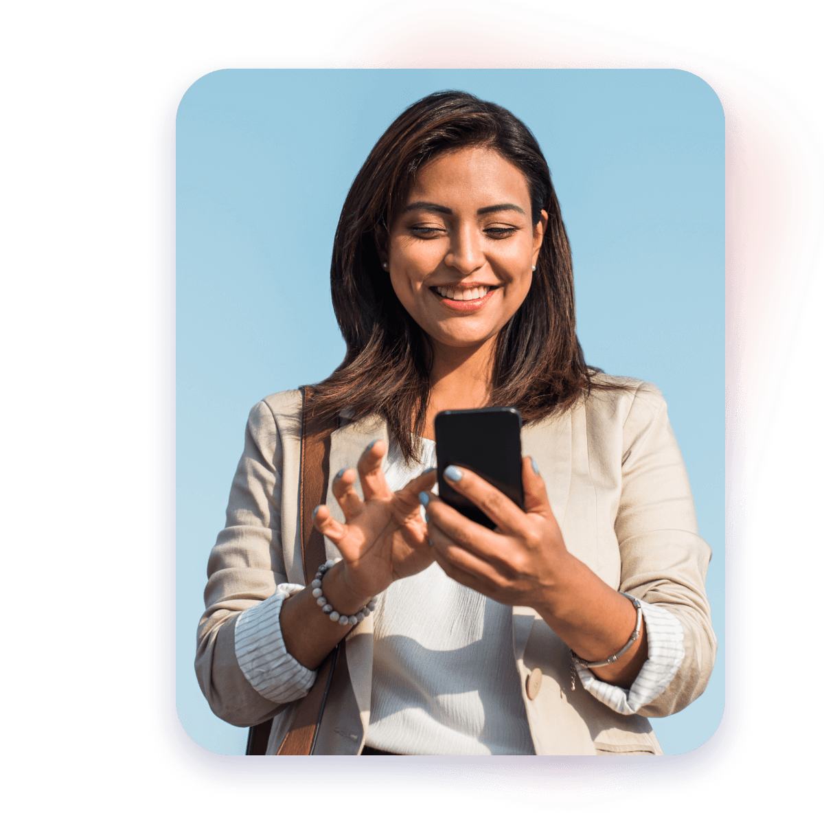 woman smiling tapping mobile device