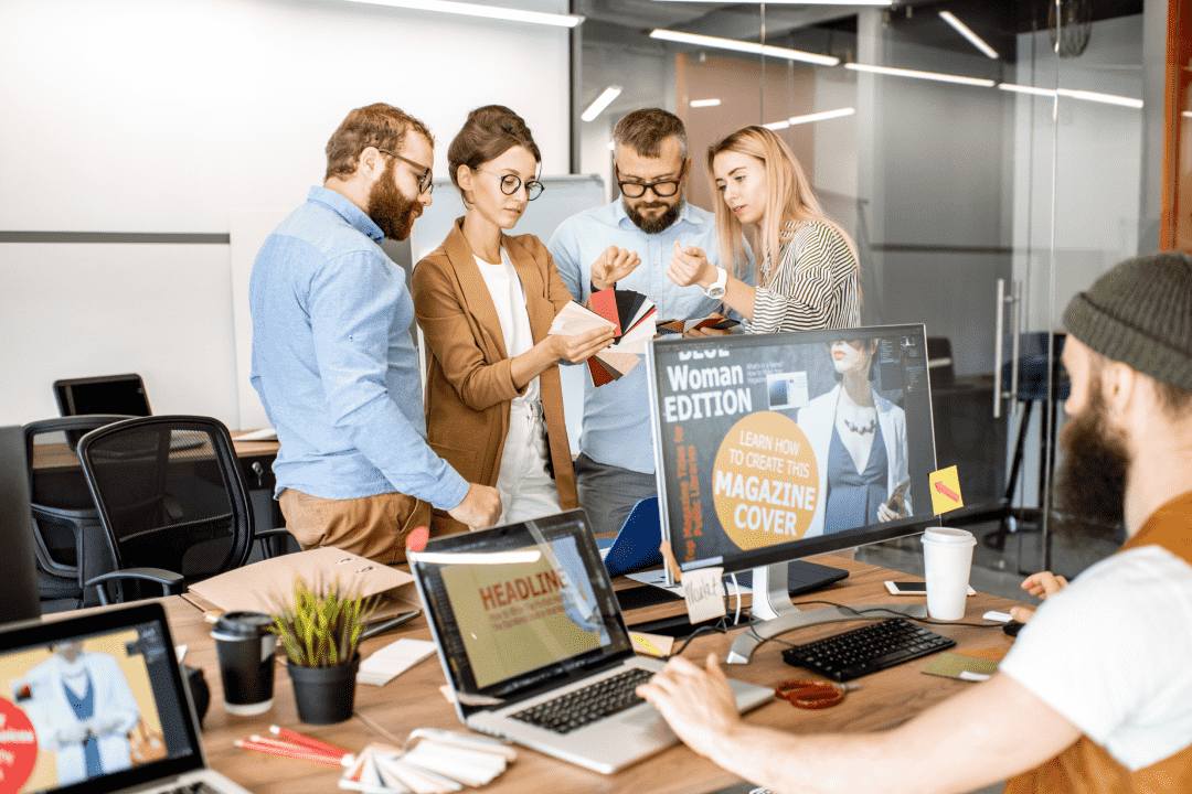 Group of people choosing colours from a palette in an office 