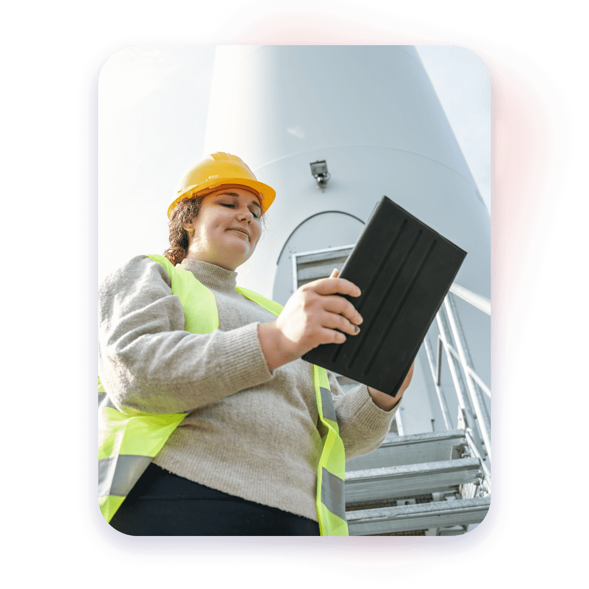 Woman with safety gear checking her tablet