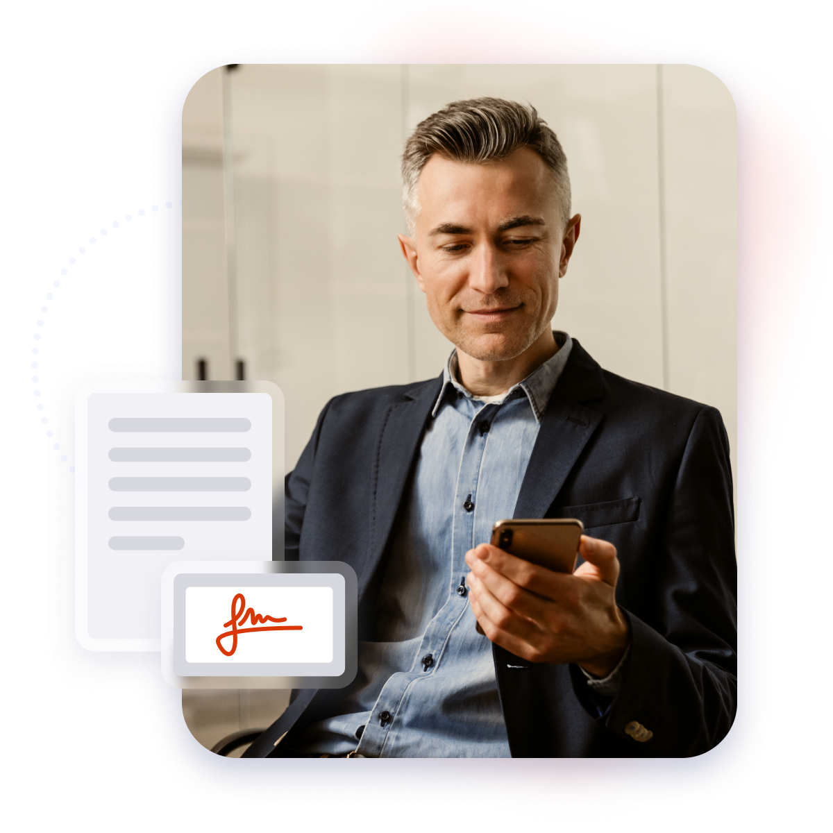 Mature and confident business man looking at his mobile phone