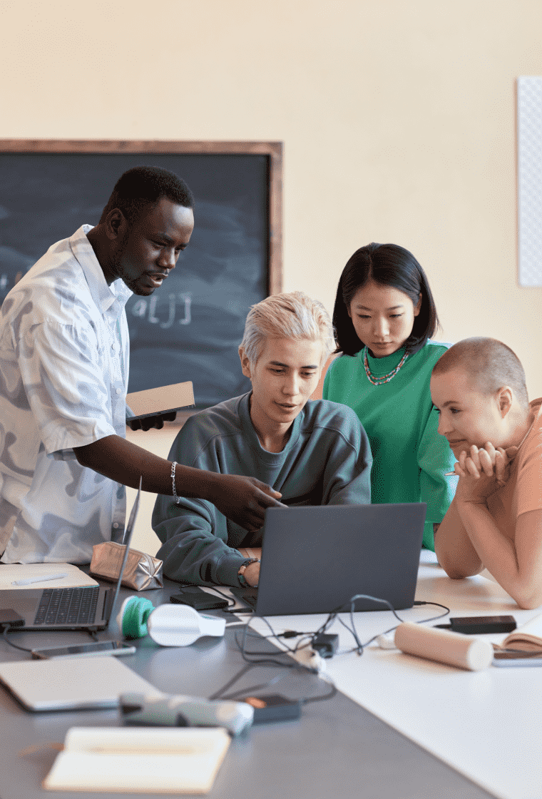 Group of students researching with a laptop