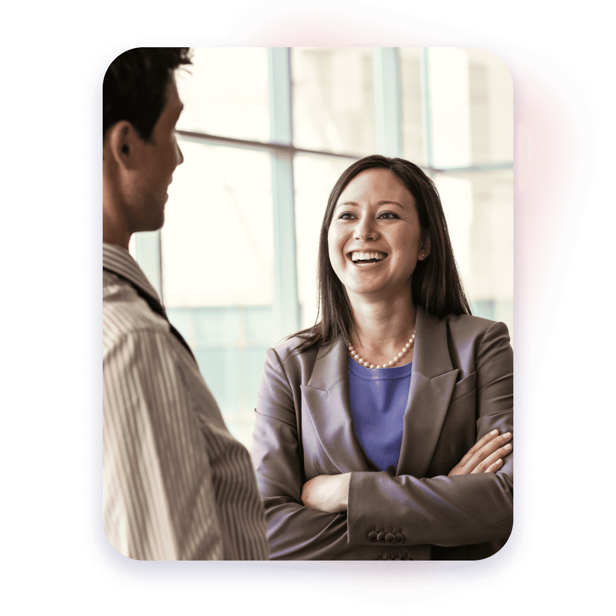 Business woman happily smiling while chatting with a partner